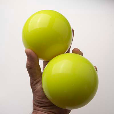 griping oversized juggling balls